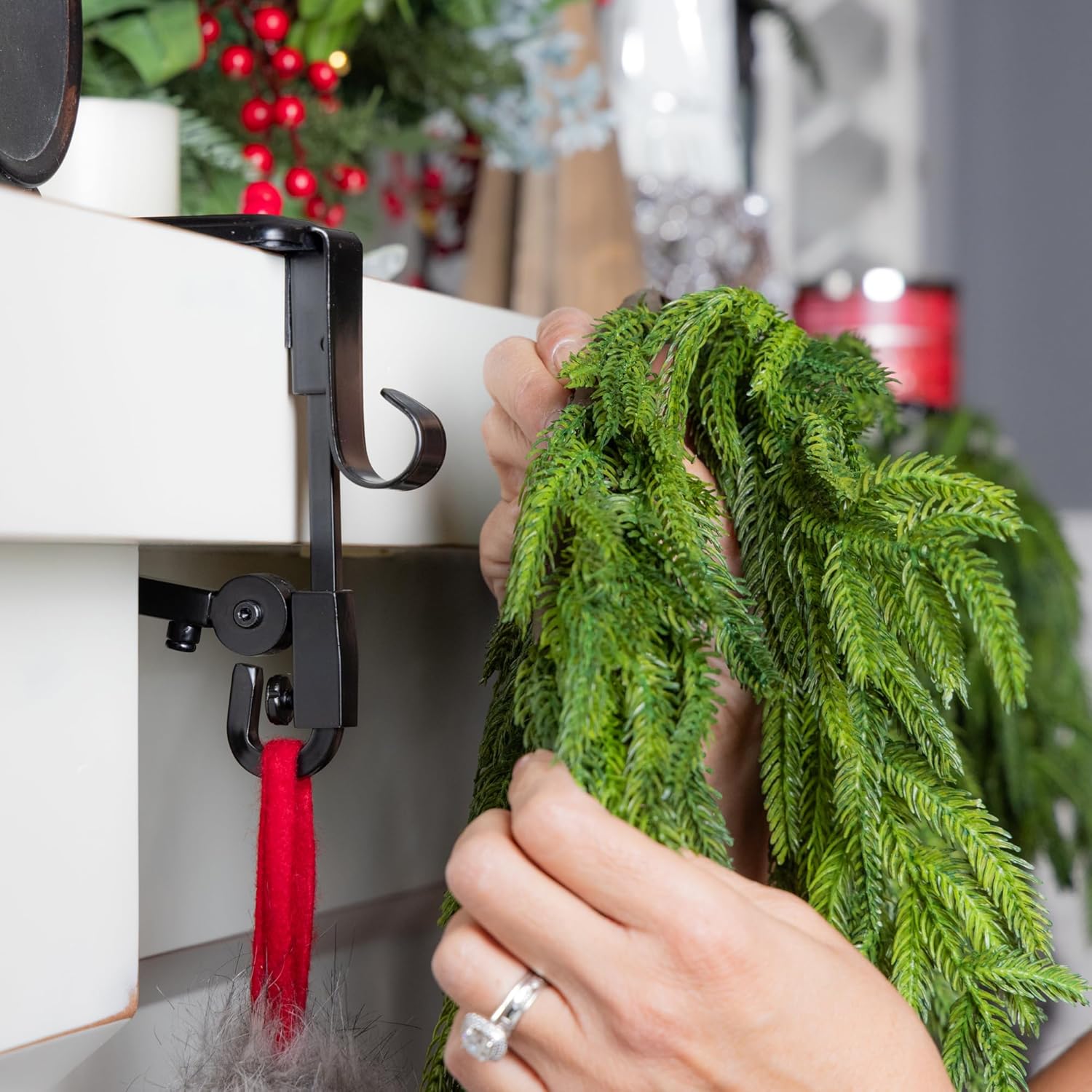 Dual hook mantle hanger holding Christmas garland